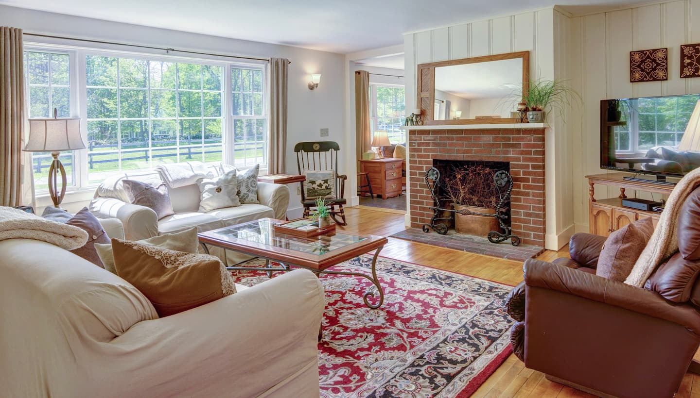 Dana Road House living room with brick fireplace