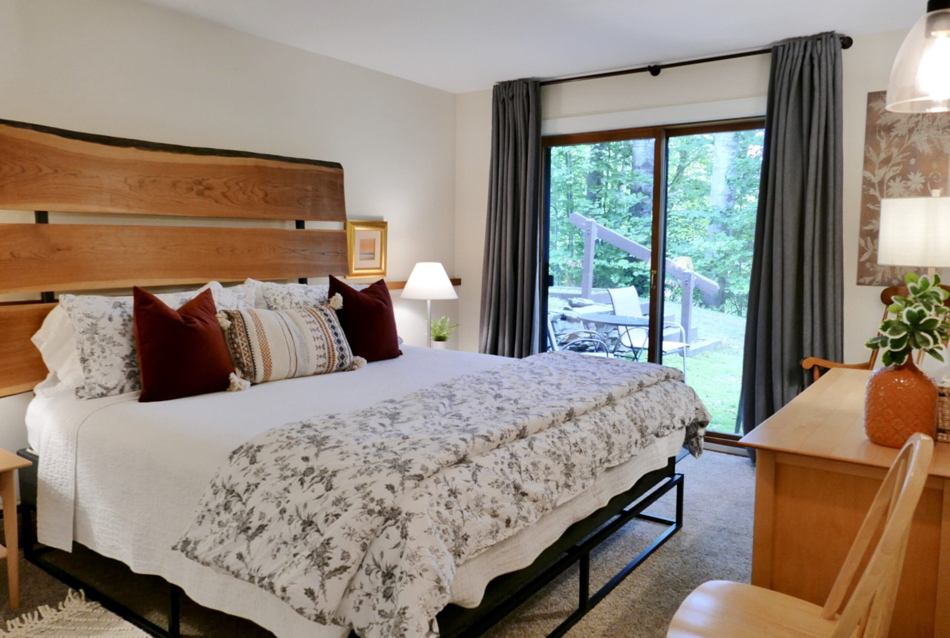 Main bedroom with custom king bed and deck access
