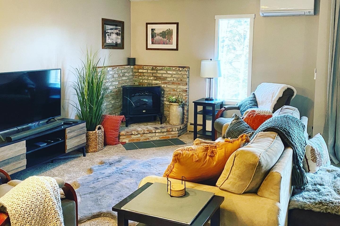 Windfall living room with brick fireplace